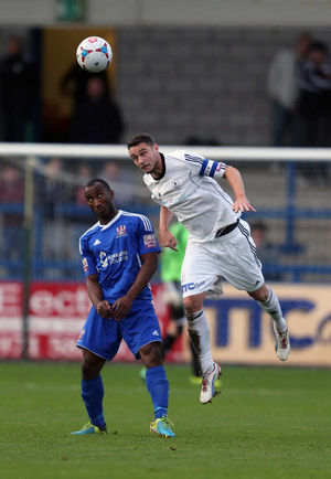 Obi Anoruo of Stalybridge Celtic and Simon Grand of AFC Telford United
