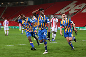 Fejiri Okenabirhie of Shrewsbury Town celebrates after scoring a goal to make it 2-2 (AMA)