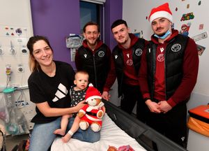 Walsall FC players visit Walsall Manor Hospital.Charlie Lakin, Conor Barrett and Jamie Jellis with Bethan and baby Otis Smith, aged 10 months.