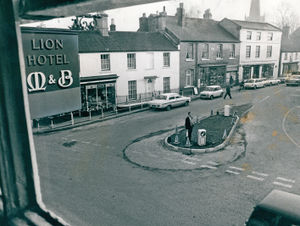Staffordshire County Council workmen arrived in the centre of Brewood, and quietly and efficiently removed a traffic island. The island (pictured) - which some residents considered a pleasant landmark - has disappeared from under the villagers' noses. But now, almost as mysteriously as it vanished, the island has suddenly re-appeared.' It has changed to a pear-shape, and is about six feet away from its original position,' said Mr Bill Burns, landlord of The Lion public house.' Workmen arrived on Monday, and now the work is almost complete,\ he added.But some people travelling through the village still seem to be unaware the island is back - until they are almost on it.Said Mr Burns: \While the island was being rebuilt, as many as three out of five cars seemed to drive straight over it until bollards were erected.' A spokesman for Stafforshire Council said the parish council asked for an investigation into traffic problems, because heavy vehicles could not negotiate the island. The county council decided to remove the island altogether.' This produced a traffic hazard, and people living nearby asked us to have another look.'