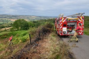 Damping down of a fire up near Minsterley on grassland. Very steep terrain.
