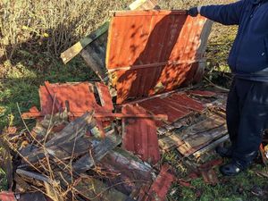 Fence panels that were dumped by a Newport resident and waste disposal company