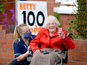 Supporting image for story: Hooray for Betty! Neighbours line Shrewsbury street for 100-year-old's birthday