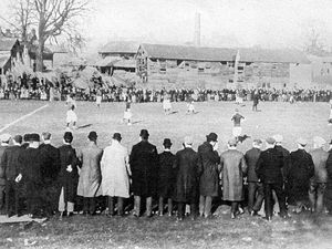 PICTURE FROM THE ARCHIVE: A postcard dated 1905 showing a football match in progress in the White Lion Meadow, Whitchurch, with Jones timber yard in the background. Tesco store now stands at this site.