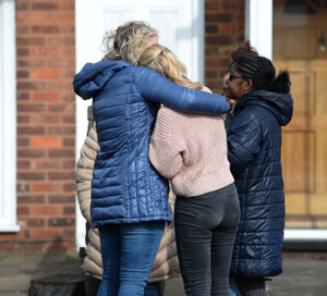 People being comforted at the scene