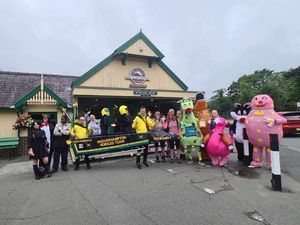 Supporting image for story: 'I'll do it again but I'm not taking the dragon!': Fancy dress Snowdon climb nets £5,000 for charity