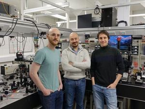 Dr Wallace Jaffray, a post-doctorate research associate, Dr Marcello Ferrera, associate professor of non-photonics, and Sven Stengel, PhD candidate, in a lab