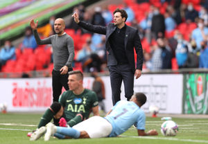 Ryan Mason on the touchline alongside Pep Guardiola in the 2021 League Cup final. (Photo by Clive Rose/Getty Images)