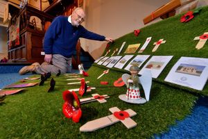 Mike Lewis at Trinity Church with some of the art