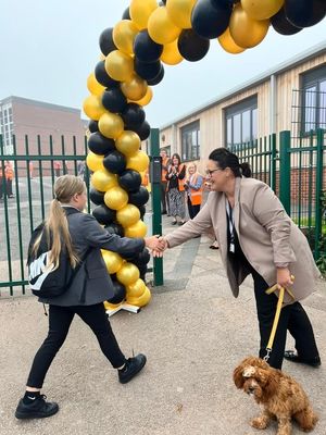 The Hart School's principal, Rachael Sandham, greeting every new pupil alongside therapy dog Rufus.