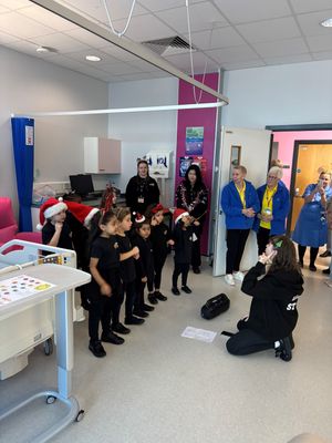 Children from a performing arts school helped lift the spirits of patients and staff at Walsall Manor Hospital with a series of festive performances