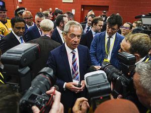 Nigel Farage talks to the media after Sarah Pochin won the Runcorn and Helsby by-election