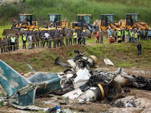 Supporting image for story: 18 dead after plane slips off runway and crashes at Nepal airport