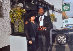 Sir Lenny Henry with his partner Lisa Makin after receiving his knighthood in 2015