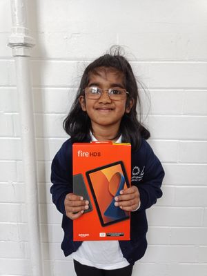 Learner Zimal with her prize