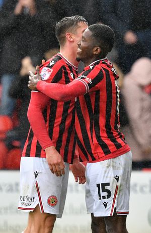Daniel Kanu celebrates his third goal in as many games for Walsall.