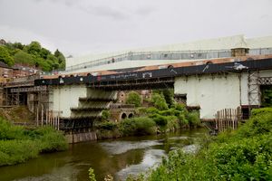 The Iron Bridge has been protected by white plastic sheets and will be repainted in its original red colour