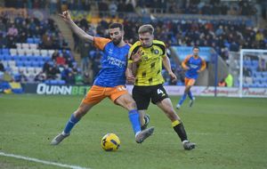 Debutant Nick Freeman battles with Jack Evans who was sent off for Harrogate 