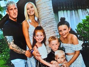 Shane Evans with his partner, Lisa, and children