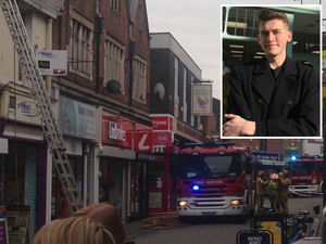 Supporting image for story: Charity shop worker helps kick down door to save family from Telford flat fire