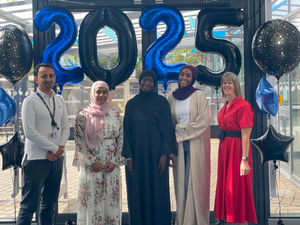 Sixth Form students celebrate their results with Jo Lawrence, Head of Sixth Form and Gulfam Shahzad, Principal.