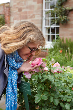 Emma smelling the roses