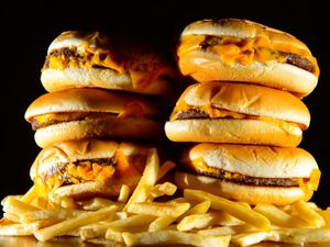 Junk food adverts will be banned before the watershed on TV and online from 2025 (Dominic Lipinski/PA)