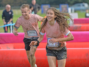 Supporting image for story: In Pictures: Runners young and old get muddy in Race for Life event