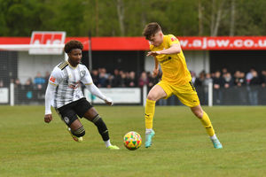 Coalville Towns Terell Pennant pressures Remi Walker (AFC Telford United Midfielder) as he runs up the wing.