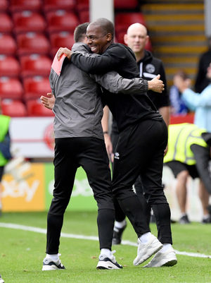 Walsall head coach Mat Sadler and Darren Byfield celebrate.
