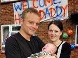 Supporting image for story: Soldier's emotional reunion with family