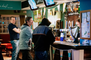 Customers have a final pint at The Cross pub, in Oldswinford, Stourbridge, on the night Boris Johnson announced the lockdown