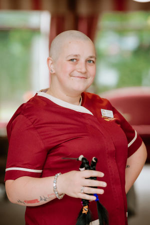 Laura Robinson holds her locks post-shave