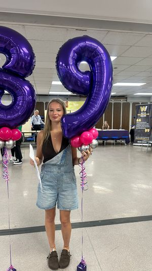 Ronni Read celebrating a grade 9 in Physics and Distinction* in Sport