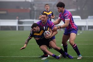 The game featured a lot of strong tackling and defence. Photo: Andy Shaw