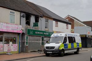 Police and fire investigators remained at the scene on Tuesday afternoon