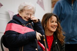 Lina Cori with granddaughter Teresa Love, shed tears of joy at her birthday celebration