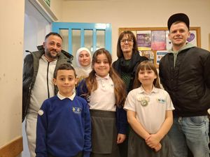 Pictured, from left, Ahmed, Abdul, Dalia, Lamar, deputy headteacher Samantha Armstrong, Lily and Lukasz. The children who spoke to the council were Abdul, Lamar and Lily.