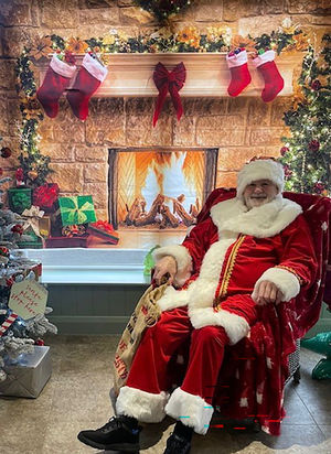 Resident Alan Bowater as Santa at HC-One’s Sedgley Court Care Home’s Christmas candy cane cavern