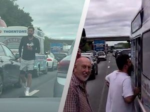 Supporting image for story: M18: Family driving home from West Midlands make the most of being near ice cream van in standstill traffic
