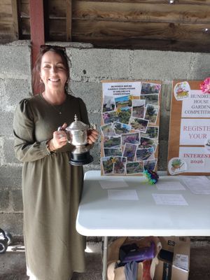 Nicola Weale collected the gardening competition cup on behalf of her parents David and Jeannie Owens