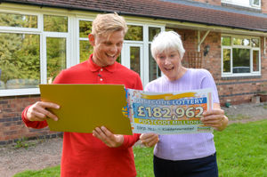 Joan, pictured with ambassador Jeff Brazier, was the only resident with the winning postcode