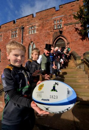 Shrewsbury Castle where a Rugby ball was passed among players and former to mark 200 years since the invention of the game