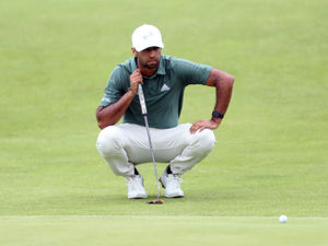Supporting image for story: Richard Mansell and Aaron Rai underway at The Open