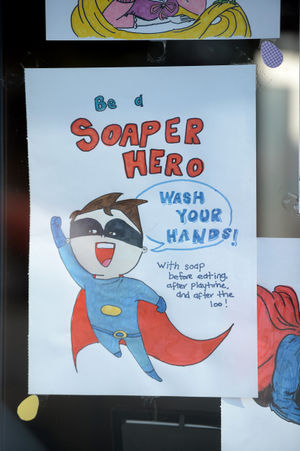 Colourful drawings have been placed in the windows of Mandy Rayner's home.
