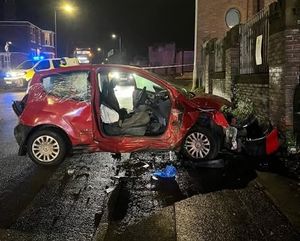 Two people have been taken to hospital following a crash between two cars in Dudley