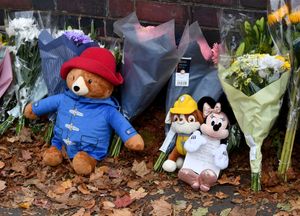 The tributes include flowers, teddy bears and heartfelt notes