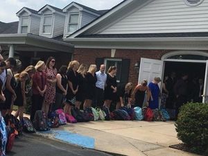 Supporting image for story: A teacher requested school backpacks instead of flowers at her funeral