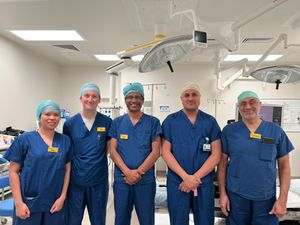 (Pictured centre) Consultant urologists Mr Fahd Khan and Mr Ananda Dhanasekaran with other members of the team who deliver HoLEP surgery