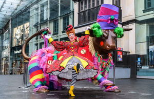 Panto Dame Andrew Ryan meets the Bull outside the Bullring in Birmingham City Centre.